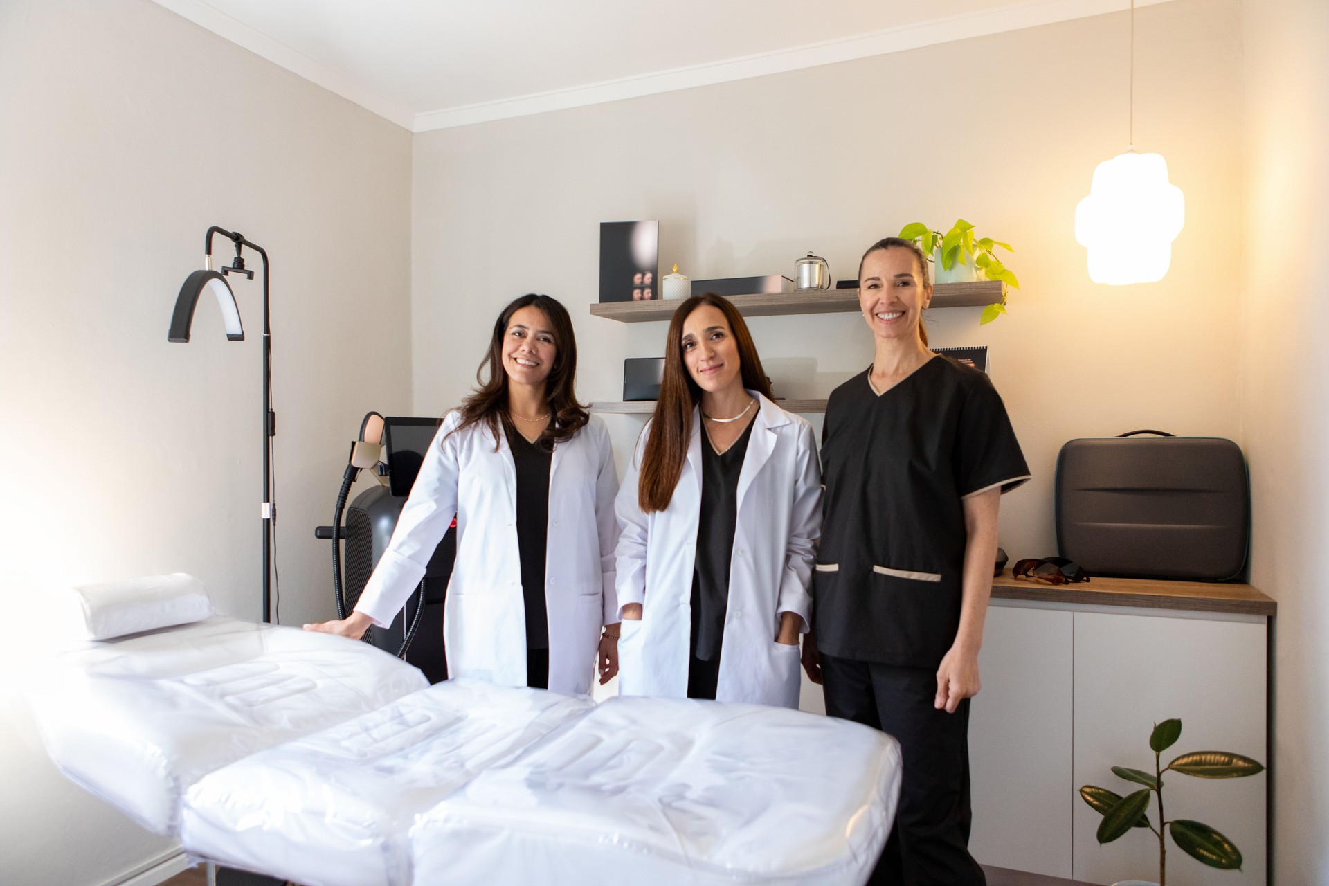 Portrait of female doctors looking at camera in clinic office